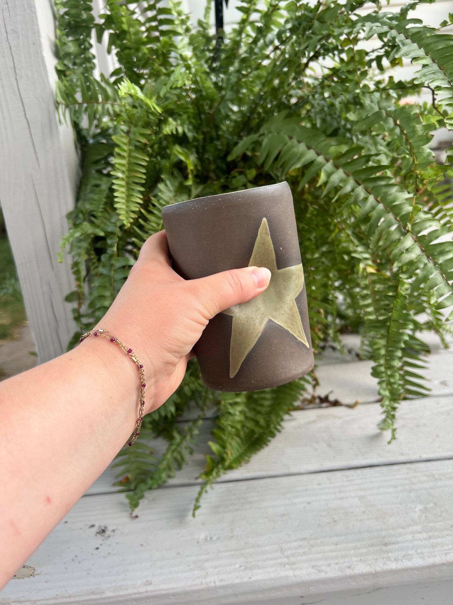 Green Star Mug on Brown Clay