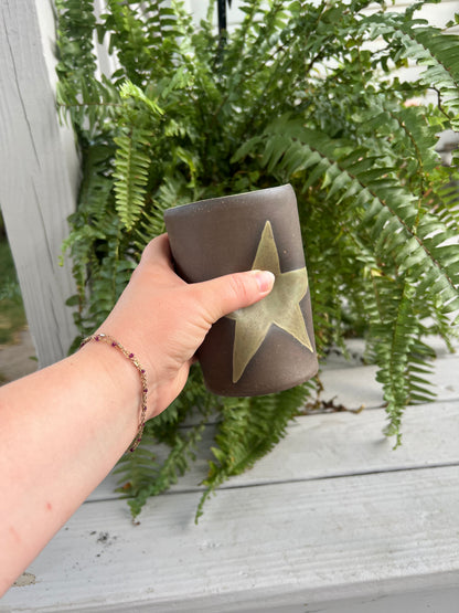 Green Star Mug on Brown Clay